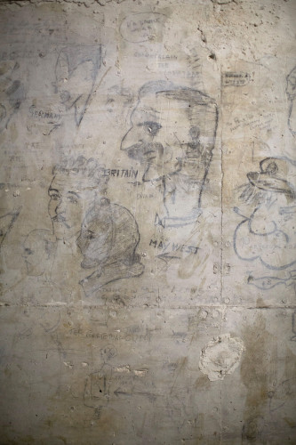 WWII-era drawings on the wall serve as a reminder of the cave's long, varied history.