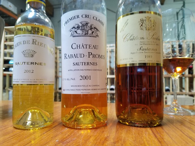 Three bottles of Sauternes show just how dramatically the color can change over time.