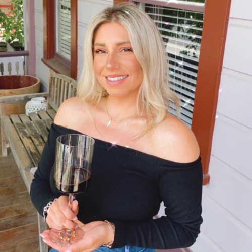 Rachel from Last Bottle Wines enjoying a glass of red on the porch
